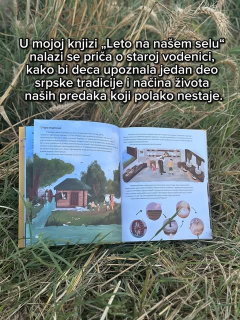 Otvorena slikovnica sa ilustracijom vodenice, položena u visoku travu i žitno klasje.